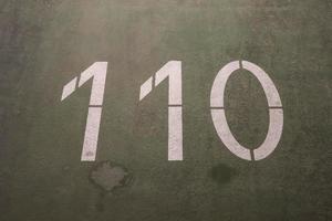 Numbers painted on concrete and asphalt surfaces photo