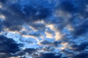 Beautiful panorama of orange and yellow clouds at sunrise photo