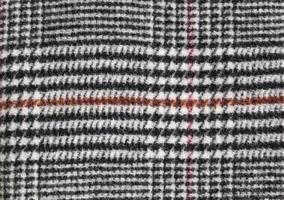 Detailed close up view on samples of cloth and fabrics in different colors found at a fabrics market photo