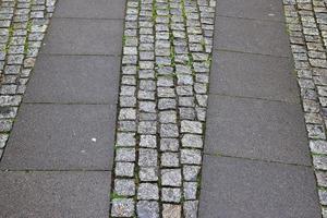 Detailed close up on old historical cobblestone roads and walkways photo