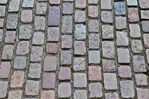 Detailed close up on old historical cobblestone roads and walkways photo