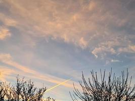 Beautiful panorama of orange and yellow clouds at sunrise photo