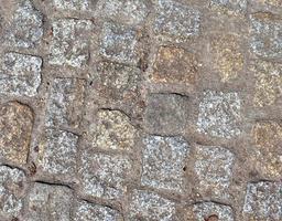 Detailed close up on old historical cobblestone roads and walkways photo