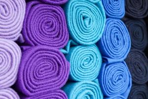 Detailed close up view on samples of cloth and fabrics in different colors found at a fabrics market photo