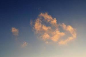 Beautiful panorama of orange and yellow clouds at sunrise photo