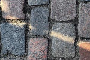 Detailed close up on old historical cobblestone roads and walkways photo