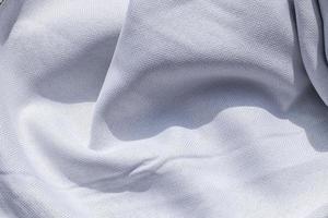 Detailed close up view on samples of cloth and fabrics in different colors found at a fabrics market photo