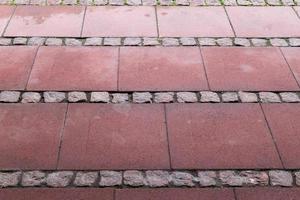 Detailed close up on old historical cobblestone roads and walkways photo