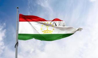 Ilustración 3d de una bandera de tayikistán - bandera de tela ondeante realista. foto