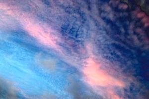 Beautiful panorama of orange and yellow clouds at sunrise photo