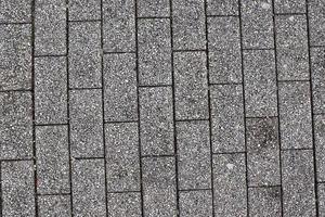 Detailed close up on old historical cobblestone roads and walkways photo