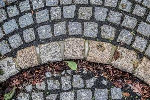 Detailed close up on old historical cobblestone roads and walkways photo