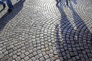 Detailed close up on old historical cobblestone roads and walkways photo