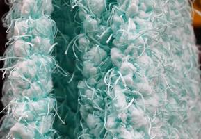 Detailed close up view on samples of cloth and fabrics in different colors found at a fabrics market photo