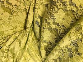 Detailed close up view on samples of cloth and fabrics in different colors found at a fabrics market photo
