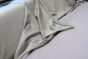Detailed close up view on samples of cloth and fabrics in different colors found at a fabrics market photo