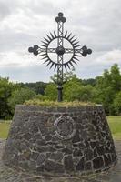 cross on stone plinth photo