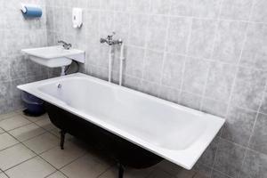 Old bathroom with sink and tiled walls. USSR photo