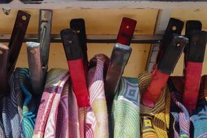 Detailed close up view on samples of cloth and fabrics in different colors found at a fabrics market photo