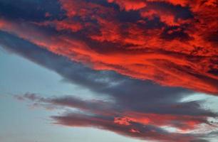 Beautiful panorama of orange and yellow clouds at sunrise photo