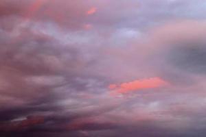 Beautiful panorama of orange and yellow clouds at sunrise photo