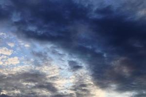 Beautiful panorama of orange and yellow clouds at sunrise photo