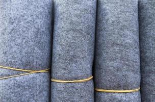 Detailed close up view on samples of cloth and fabrics in different colors found at a fabrics market photo
