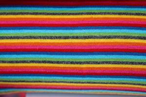 Detailed close up view on samples of cloth and fabrics in different colors found at a fabrics market photo