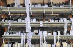 Detailed close up view on samples of cloth and fabrics in different colors found at a fabrics market photo