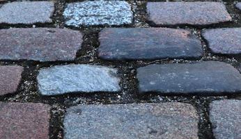 Detailed close up on old historical cobblestone roads and walkways photo