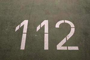 Numbers painted on concrete and asphalt surfaces photo