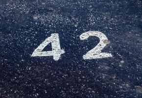 Numbers painted on concrete and asphalt surfaces photo