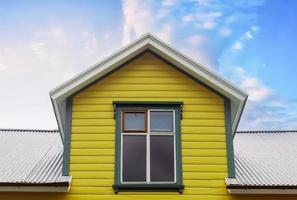 Roof window in velux style with roof tiles - icelandic architecture. photo