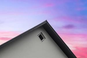 Roof window in velux style with roof tiles - icelandic architecture. photo