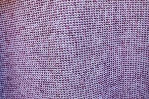 Detailed close up view on samples of cloth and fabrics in different colors found at a fabrics market photo