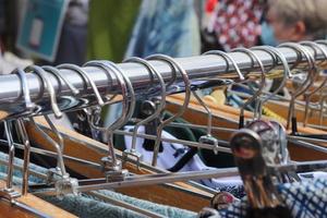 Detailed close up view on samples of cloth and fabrics in different colors found at a fabrics market photo