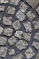 Detailed close up on old historical cobblestone roads and walkways photo