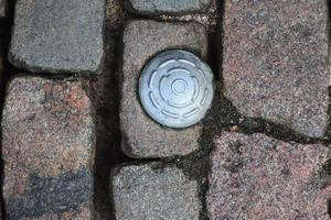 Detailed close up on old historical cobblestone roads and walkways photo