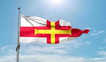 Guernsey flag - realistic waving fabric flag. photo