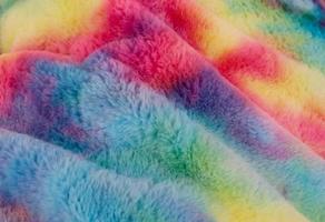 Detailed close up view on samples of cloth and fabrics in different colors found at a fabrics market photo