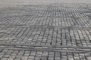 Detailed close up on old historical cobblestone roads and walkways photo