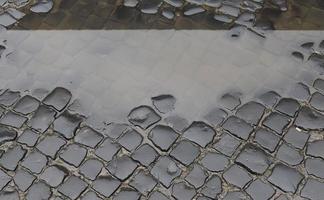 Detailed close up on old historical cobblestone roads and walkways photo