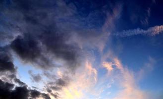 Beautiful panorama of orange and yellow clouds at sunrise photo