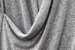 Detailed close up view on samples of cloth and fabrics in different colors found at a fabrics market photo