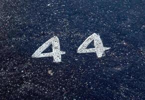 Numbers painted on concrete and asphalt surfaces photo