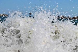 Detailed close up view on water surfaces with ripples and waves and the sunlight reflecting at the surface photo