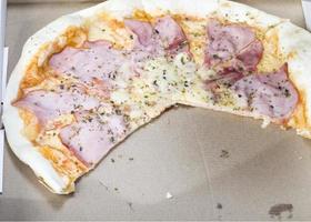 one pizza stuffed with ham photo