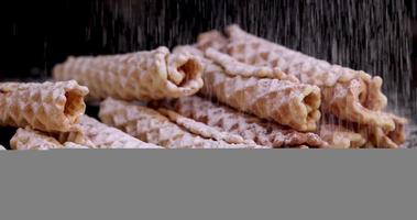 crispy waffles are sprinkled with white powdered sugar photo