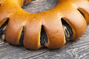 fresh bun with black poppy seed filling photo