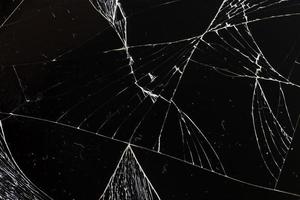 broken thin glass with lots of cracks photo